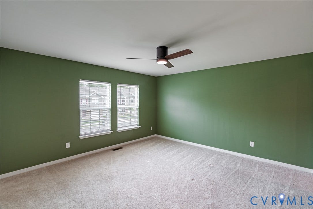 11419 Dunmore Mill Court, Chester, VA 23831 Carpeted interior with a ceiling fan, two windows, and blinds