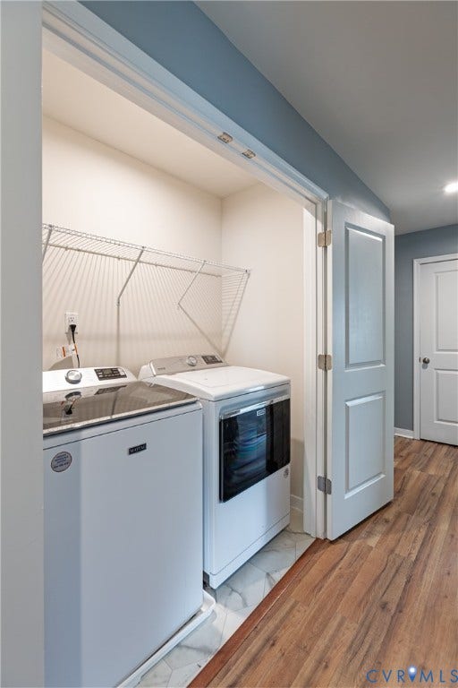 11419 Dunmore Mill Court, Chester, VA 23831 Dedicated laundry area with wire shelving and white appliances, featuring wood-finish flooring
