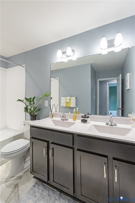 11419 Dunmore Mill Court, Chester, VA 23831 Dual vanity with integrated sinks, dark wood-finish cabinetry, and contemporary hardware