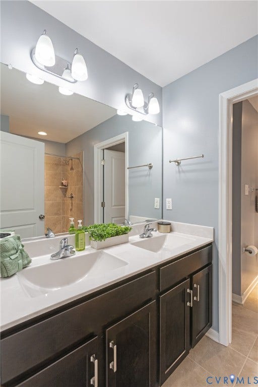 11419 Dunmore Mill Court, Chester, VA 23831 Dual vanity with white undermount sinks, chrome fixtures, and dark wood-finish cabinetry