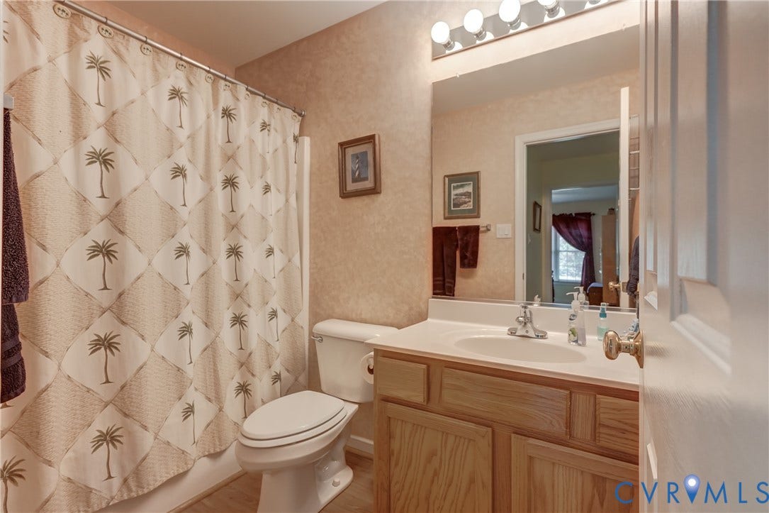 4229 Greenbriar Drive, Chester, VA 23831 Integrated vanity with a single basin, undermount cabinetry, and an overhead mirror
