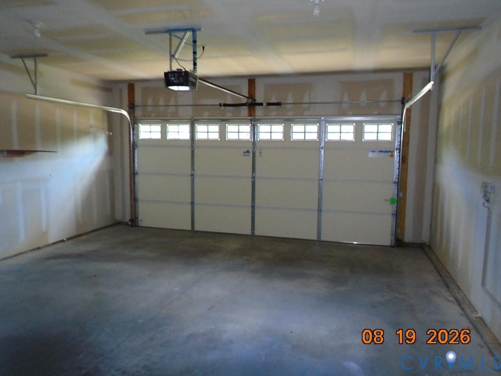 4113 Coles Point Way, Glen Allen, VA 23060 Single-bay garage featuring a concrete floor and an automatic garage door opener
