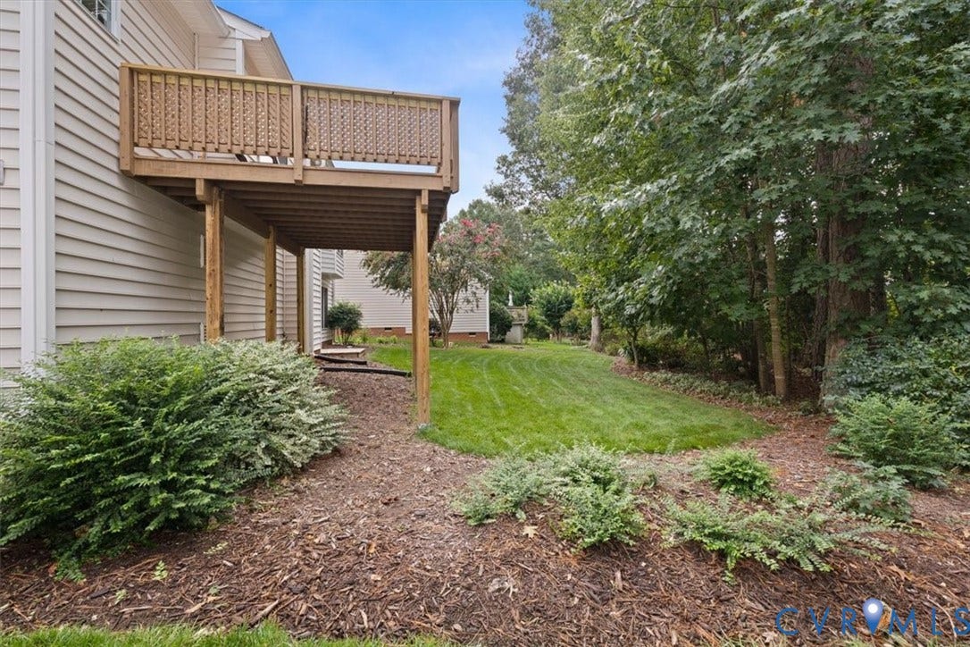 13819 Ashbourne Hollow Circle, Birkdale, Chesterfield, VA 23832 Wood deck with railing, siding exterior, mature trees, and landscaped grounds