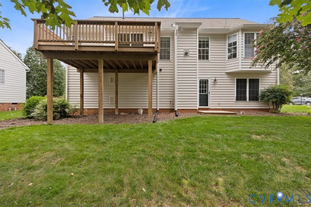 13819 Ashbourne Hollow Circle, Birkdale, Chesterfield, VA 23832 Elevated wood deck with railing, bay window and rear entry door from first floor