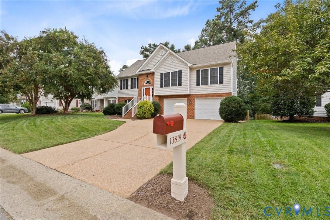 13819 Ashbourne Hollow Circle, Birkdale, Chesterfield, VA 23832 Two-story exterior with brick and vinyl siding, aggregate driveway and beautifully landscaped yard