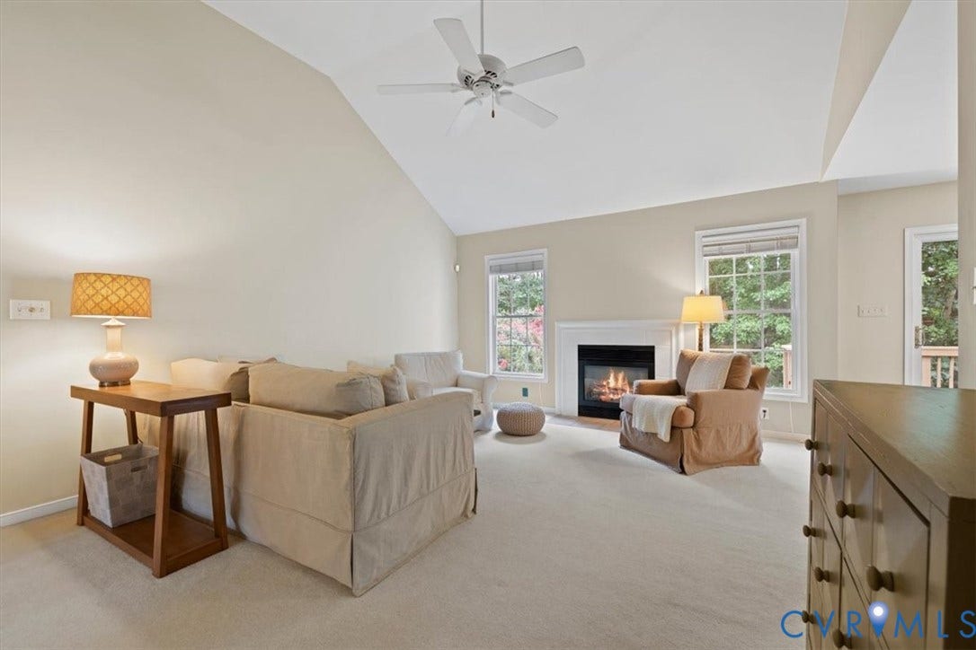 13819 Ashbourne Hollow Circle, Birkdale, Chesterfield, VA 23832 Vaulted ceiling with a ceiling fan, and a fireplace with a white mantel