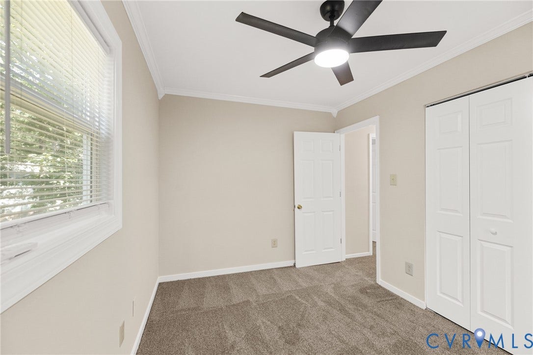5401 Solaris Drive, Chesterfield, VA 23832 Neutral wall color, wall-to-wall carpeting, ceiling fan with integrated lighting, window with blinds, and bi-fold closet doors