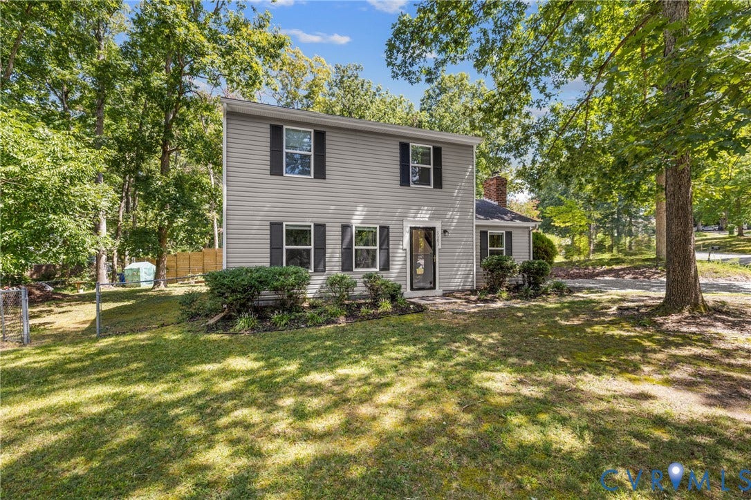 5401 Solaris Drive, Chesterfield, VA 23832 Colonial-style two-story residence with gray vinyl siding and black shutters, situated on a mature, tree-lined lot