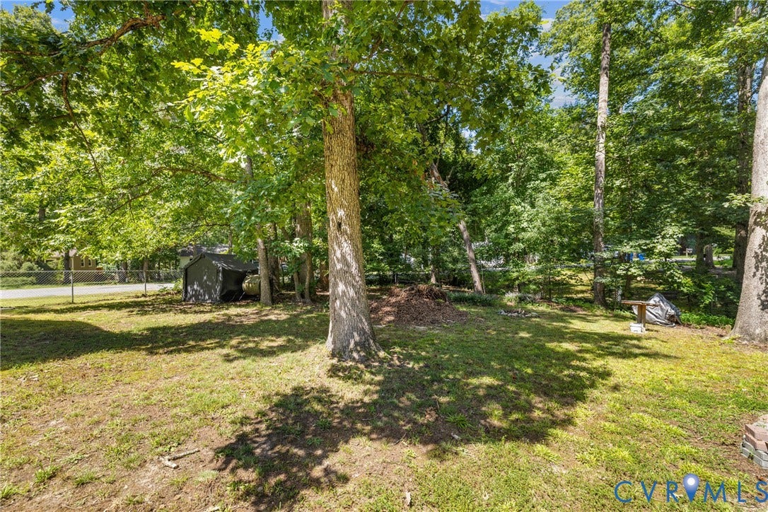 5401 Solaris Drive, Chesterfield, VA 23832 Expansive yard featuring mature trees and a storage shed