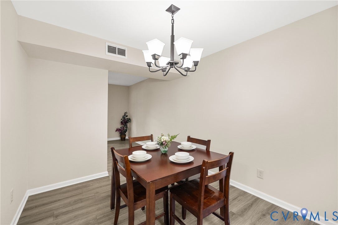 5401 Solaris Drive, Chesterfield, VA 23832 Wood-finish flooring, recessed ceiling, and a contemporary chandelier