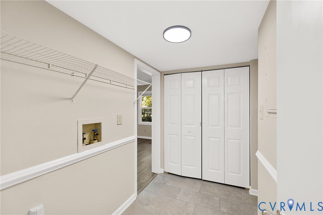 5401 Solaris Drive, Chesterfield, VA 23832 Utility area with tile flooring, bifold closet doors, and wire shelving