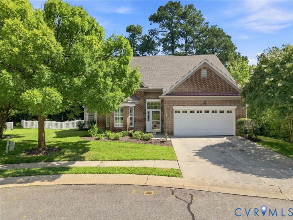 Brick exterior with a gabled roof and white trim
