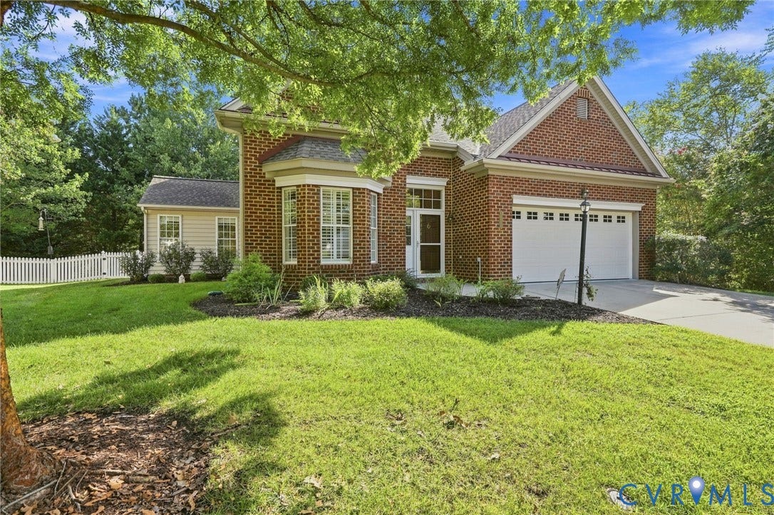 Brick exterior with a prominent bay window