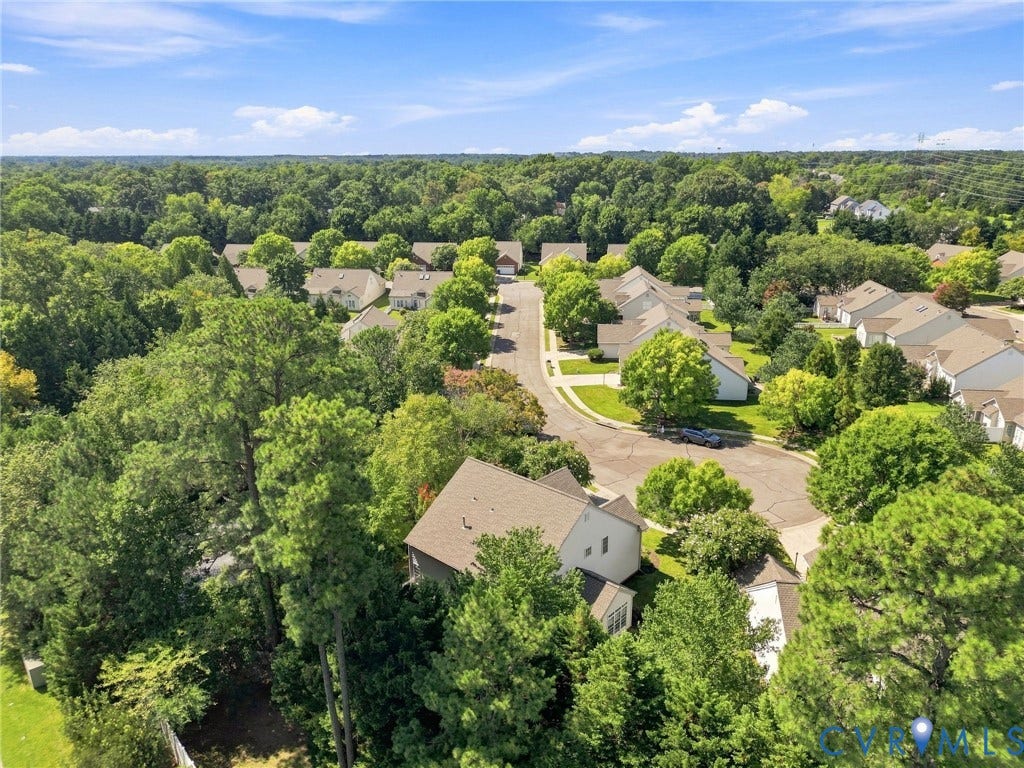 Neighborhood setting with mature trees and established residences