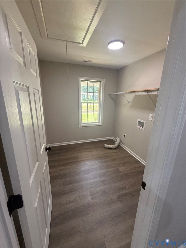 3430 The Loop Rd, Glendale, Montross, VA 23231 Wood-finish flooring with white baseboards, a window, and shelving