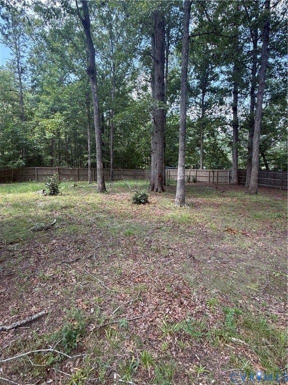 3430 The Loop Rd, Glendale, Montross, VA 23231 Wood-paneled fencing enclosing a natural landscape with mature trees