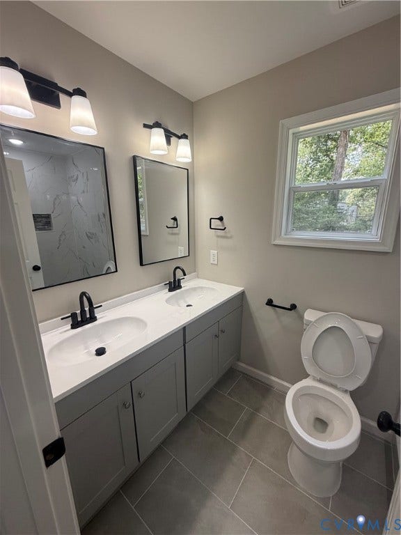 3430 The Loop Rd, Glendale, Montross, VA 23231 Dual vanity with matte black fixtures, light gray cabinetry, and white countertops