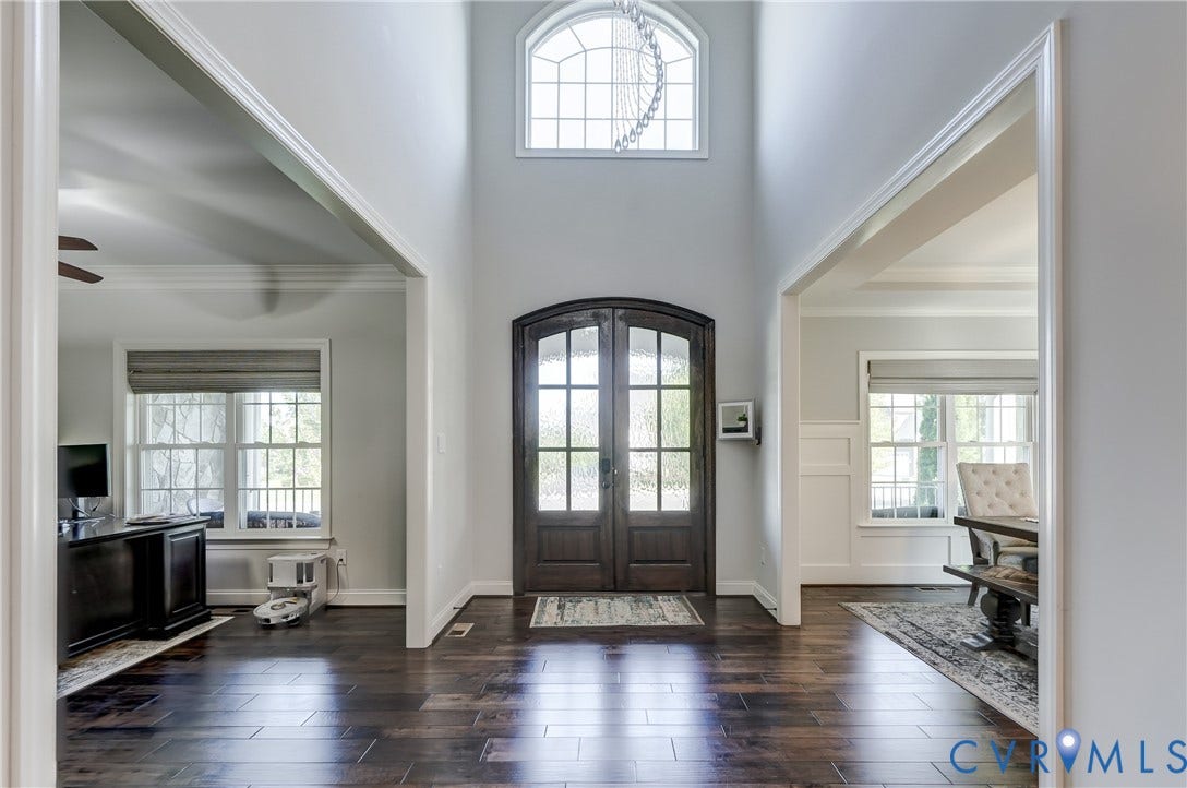 11515 Grey Oaks Estates Run, Grey Oaks Estates, Glen Allen, VA 23059 Grand entryway featuring a two-story ceiling, arched transom window, dark wood-finish flooring, and double arched-top entry doors