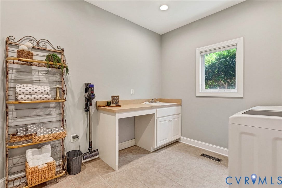 Recessed lighting, tile flooring, window with natural light, built-in cabinetry, and integrated sink