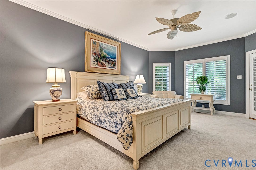 Recessed lighting, crown molding, ceiling fan, carpeted flooring, and plantation shutters