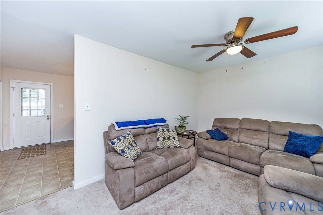 2765 Meadowbrook Street, Petersburg, VA 23803 Recessed lighting, wood-finish ceiling fan, white paneled door with glass inserts, and tile flooring