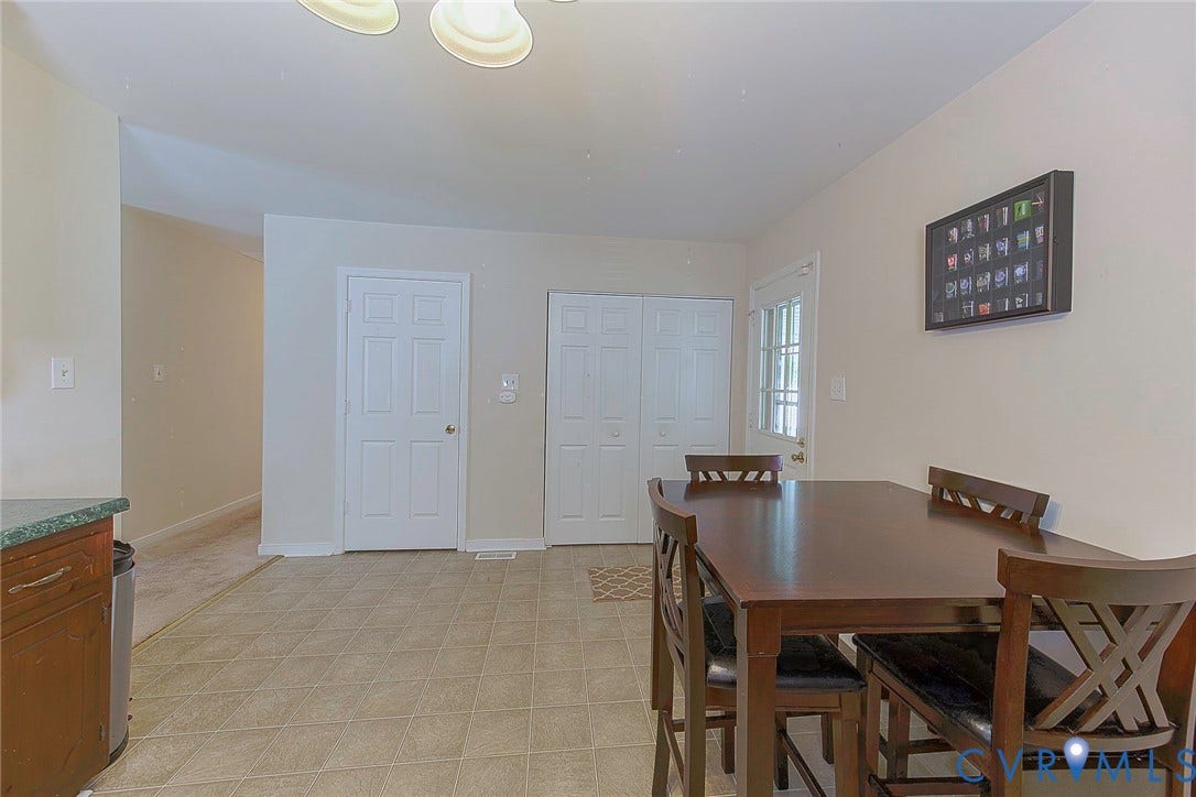 2765 Meadowbrook Street, Petersburg, VA 23803 Tiled flooring, white paneled interior doors, and a glass-paneled exterior door