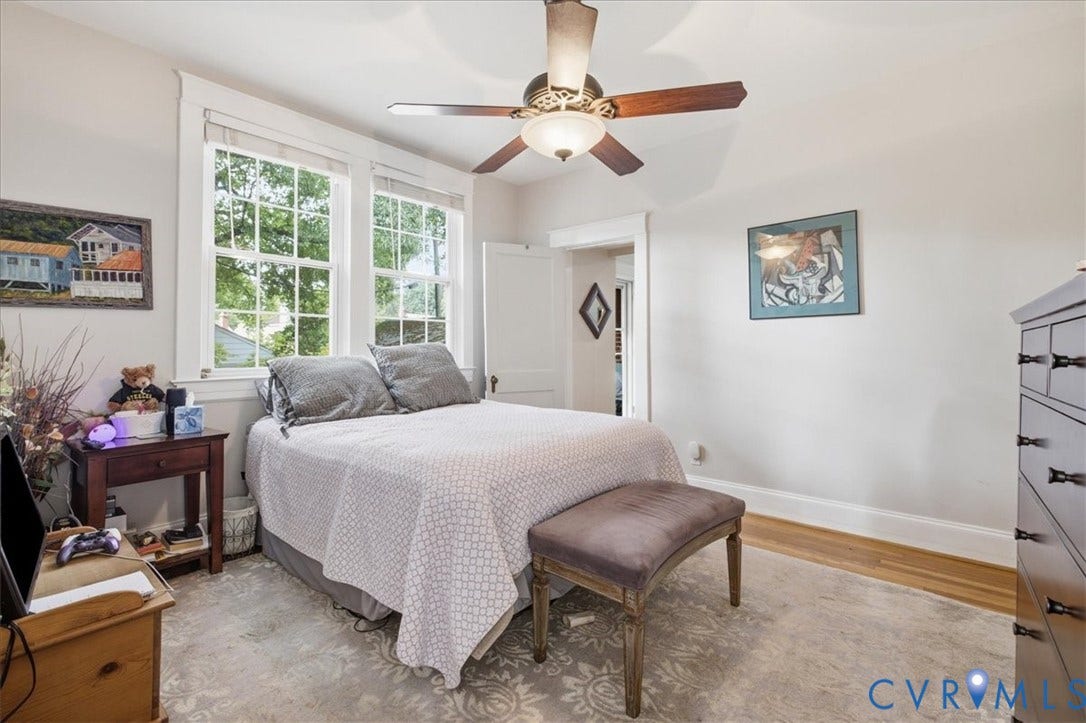 4702 New Kent Avenue, Westover Hills, Richmond, VA 23225 Dual windows, wood-finish flooring, ceiling fan with integrated lighting, and white trim