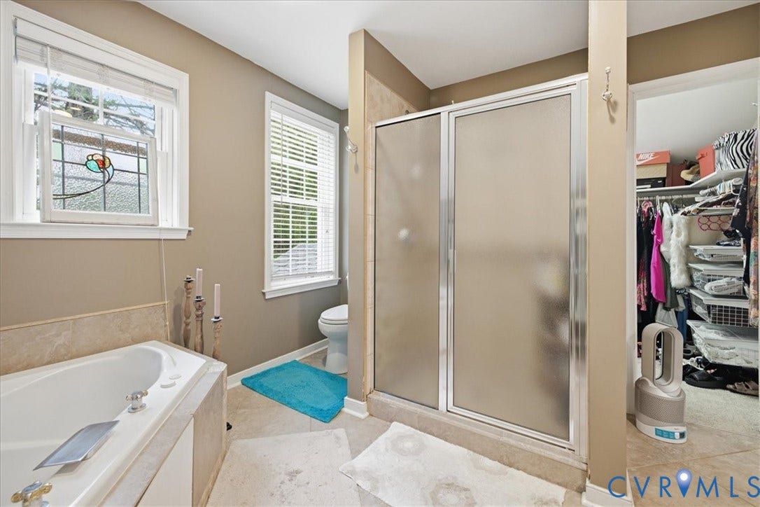 4702 New Kent Avenue, Westover Hills, Richmond, VA 23225 Built-in soaking tub, glass-enclosed shower, dual windows with blinds, and tiled flooring