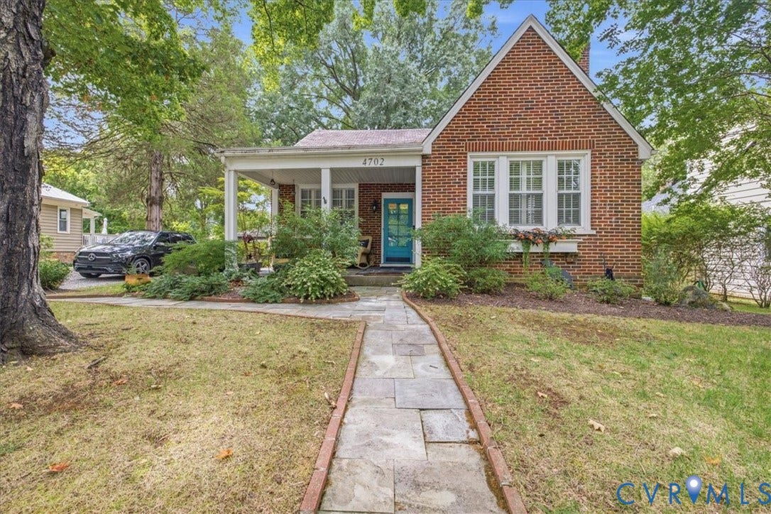 4702 New Kent Avenue, Westover Hills, Richmond, VA 23225 Brick exterior with a gabled roofline, covered porch, and mature landscaping