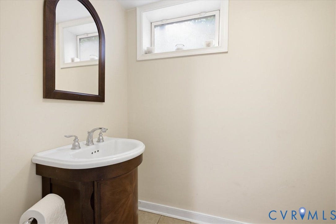 4702 New Kent Avenue, Westover Hills, Richmond, VA 23225 Pedestal vanity with a porcelain sink and chrome faucet in basement