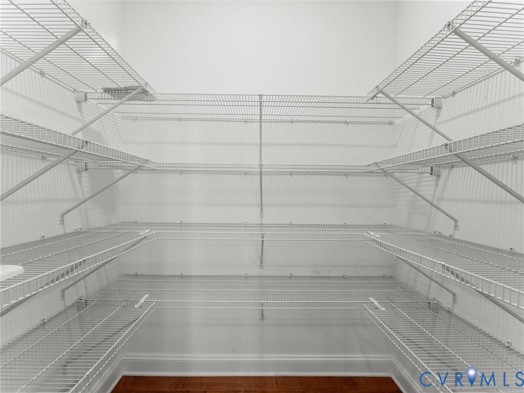 14227 Michaux Village Drive, Winterfield Park, Midlothian, VA 23113 Built-in wire shelving system with multiple tiers, white wall finish, and wood-finish flooring