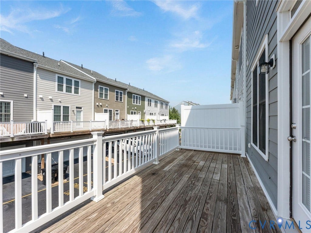 14227 Michaux Village Drive, Winterfield Park, Midlothian, VA 23113 Deck with a wood-finish surface, white railing, and a privacy fence