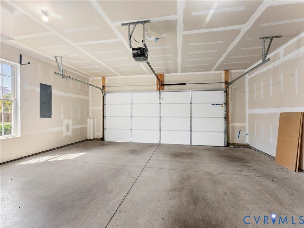 14227 Michaux Village Drive, Winterfield Park, Midlothian, VA 23113 Attached garage with a white sectional door, concrete flooring, and a single window