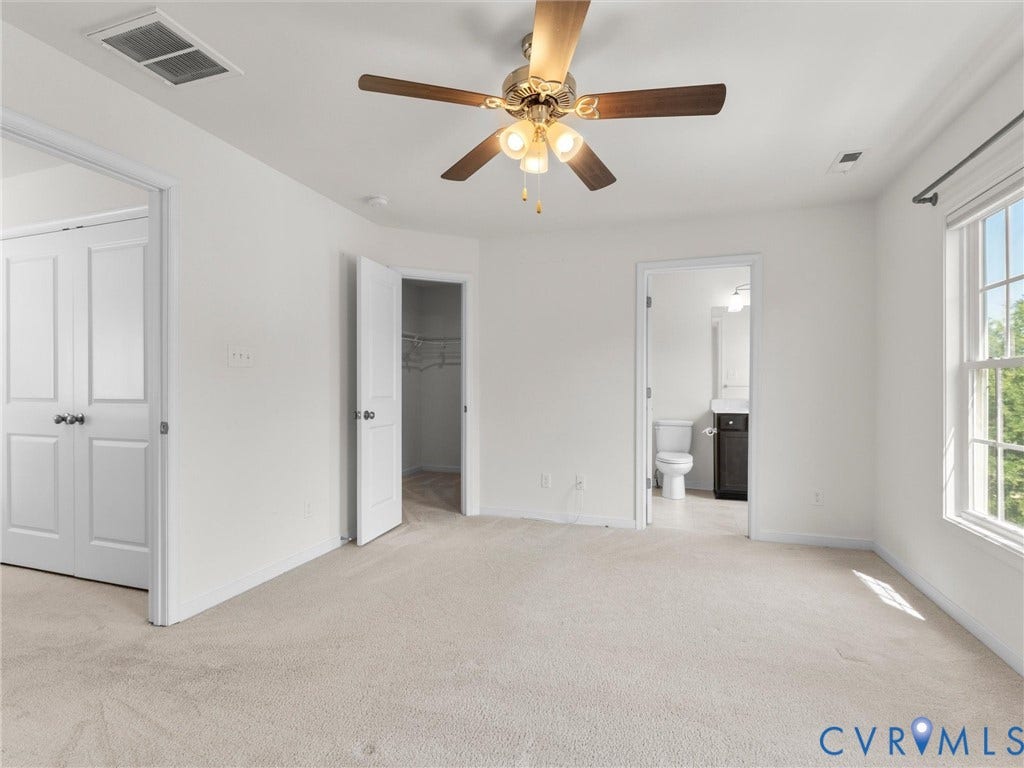 14227 Michaux Village Drive, Winterfield Park, Midlothian, VA 23113 Neutral-toned carpeting, white walls, and a ceiling fan with integrated lighting