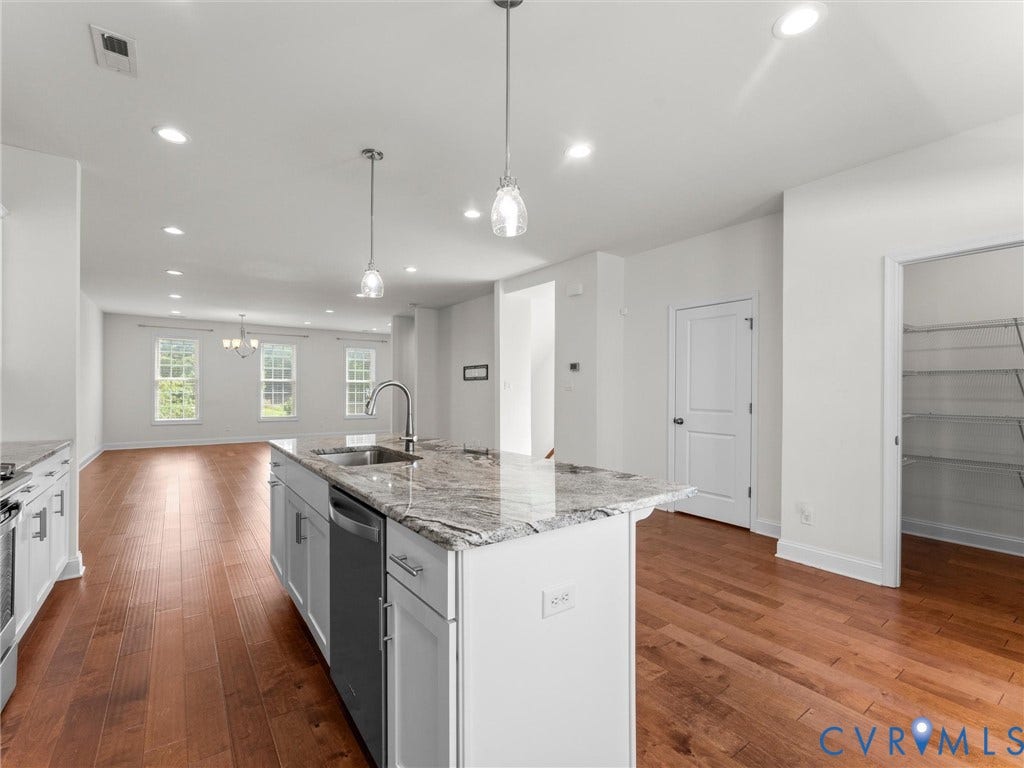 14227 Michaux Village Drive, Winterfield Park, Midlothian, VA 23113 Kitchen island with stone countertop, integrated sink, and stainless steel dishwasher