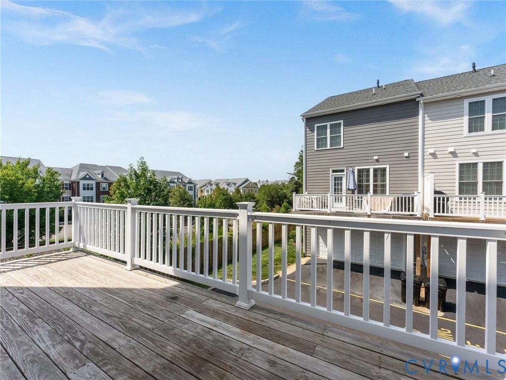 14227 Michaux Village Drive, Winterfield Park, Midlothian, VA 23113 Expansive outdoor deck with white railings, offering an open-air living space