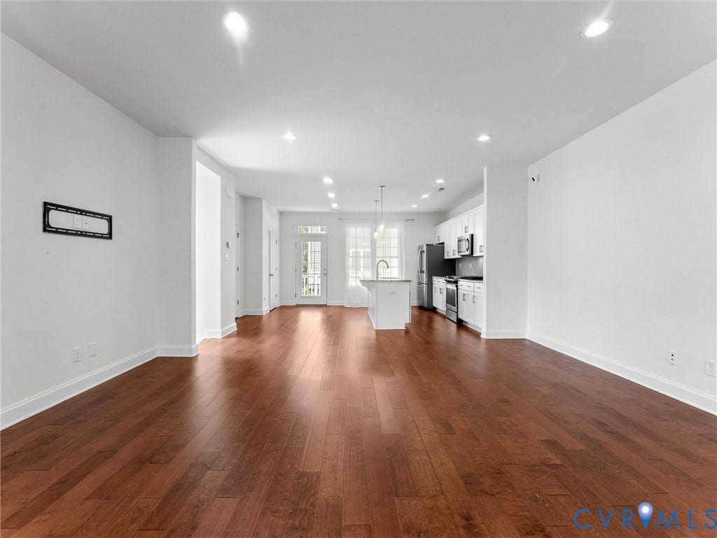 14227 Michaux Village Drive, Winterfield Park, Midlothian, VA 23113 Wood-finish flooring throughout, recessed lighting, white perimeter cabinetry, stainless steel appliances, and a central island with an integrated sink