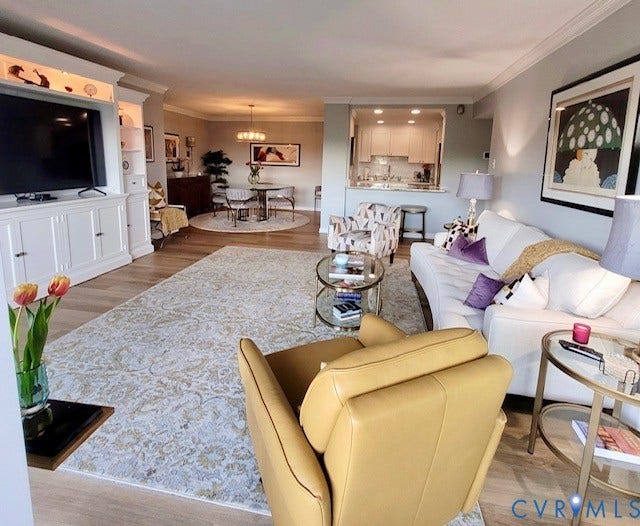 Wood-finish flooring throughout, with a built-in media center featuring accent lighting