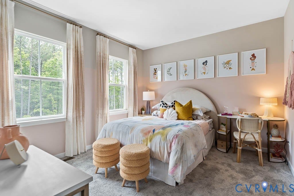 16074 Greenhart Drive, Chesterfield, VA 23832 Two large double-hung windows with surrounding trim, light-colored walls, carpeted flooring, and a built-in desk with shelving