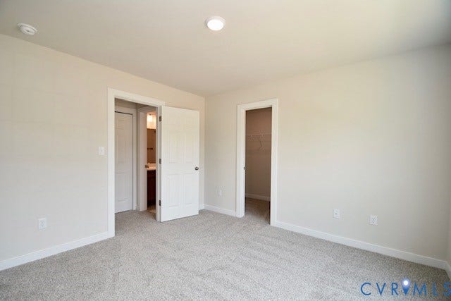 410 Kents Mill Rd, Louisa, VA 23093 Neutral wall color with recessed lighting, plush carpet, and white trim