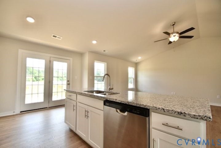 410 Kents Mill Rd, Louisa, VA 23093 Kitchen island with granite-finish countertop, stainless steel sink, and chrome faucet