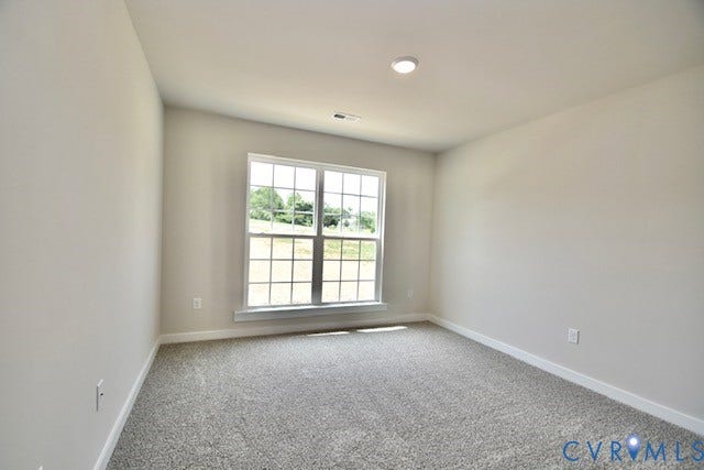 410 Kents Mill Rd, Louisa, VA 23093 Neutral wall paint, recessed ceiling light, white trim, and a window with grid pattern