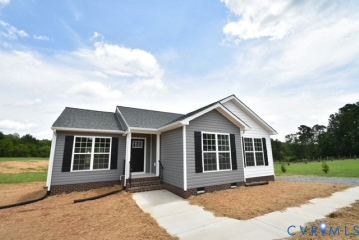 410 Kents Mill Rd, Louisa, VA 23093 Contemporary ranch-style home featuring gray siding, white trim, and a dark shingled roof
