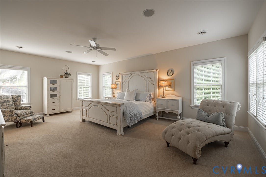 12917 Holmbank Lane, Henrico, VA 23233 Expansive room with neutral carpeting and a ceiling fan
