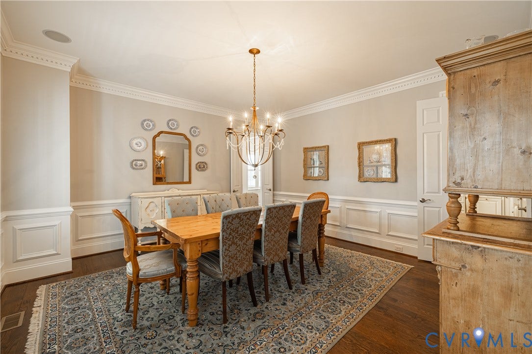12917 Holmbank Lane, Henrico, VA 23233 Hardwood flooring, extensive crown molding, wainscoting, recessed ceiling lighting, and a chandelier