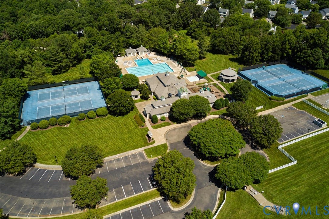 12917 Holmbank Lane, Henrico, VA 23233 Expansive grounds featuring multiple tennis courts, a large swimming pool, and a dedicated parking area