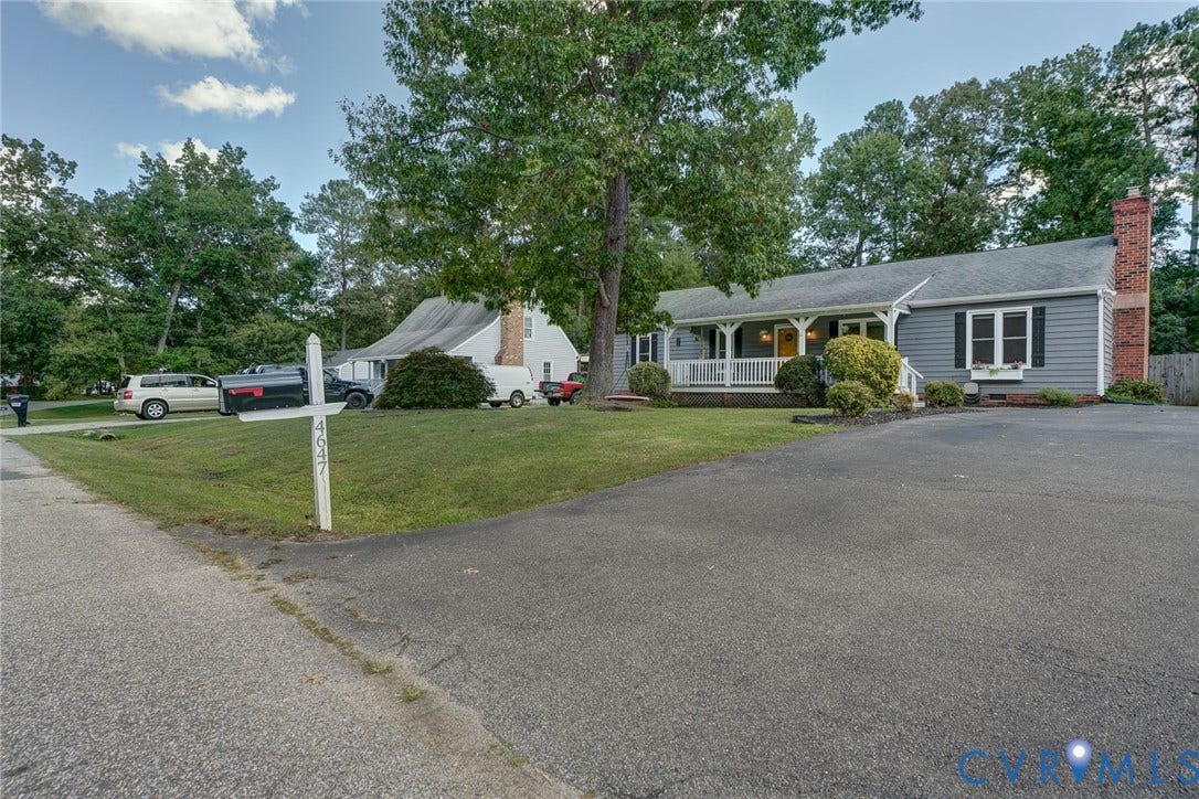 4647 Brookridge Road, Chesterfield, VA 23832 Siding exterior with a covered porch, white railings, and a brick chimney