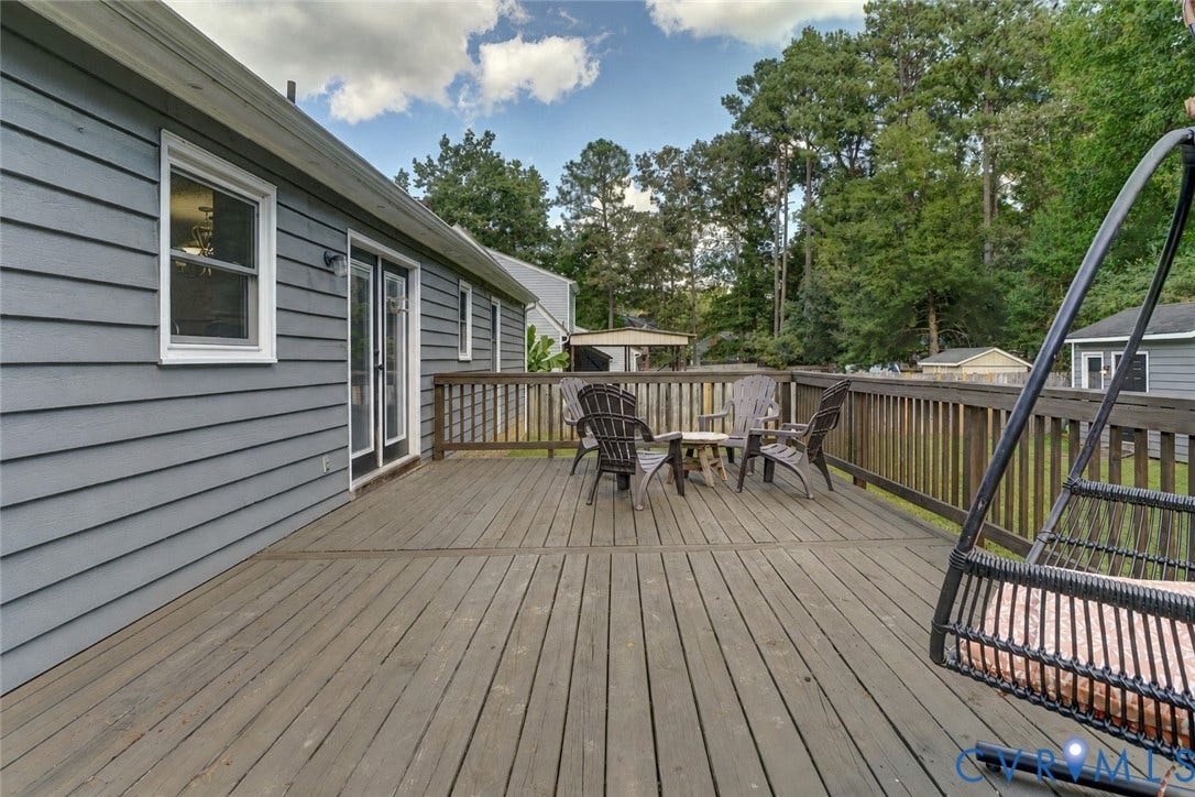 4647 Brookridge Road, Chesterfield, VA 23832 Expansive wooden deck with a wooden railing and double glass doors
