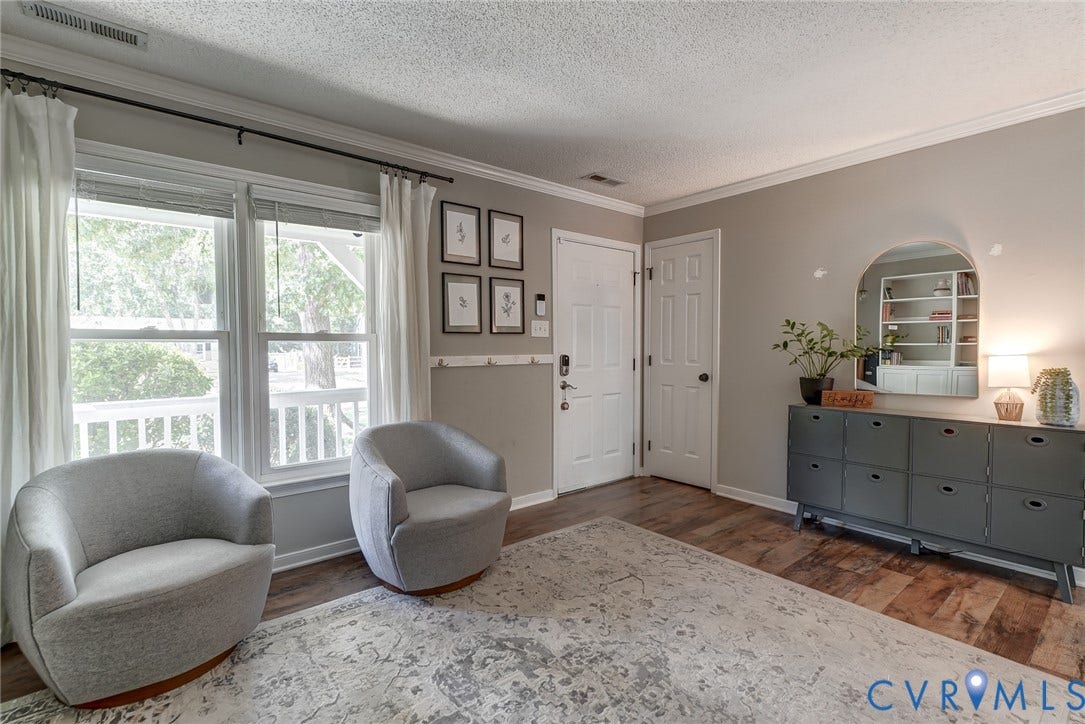 4647 Brookridge Road, Chesterfield, VA 23832 Wood-finish flooring, white trim, and crown molding