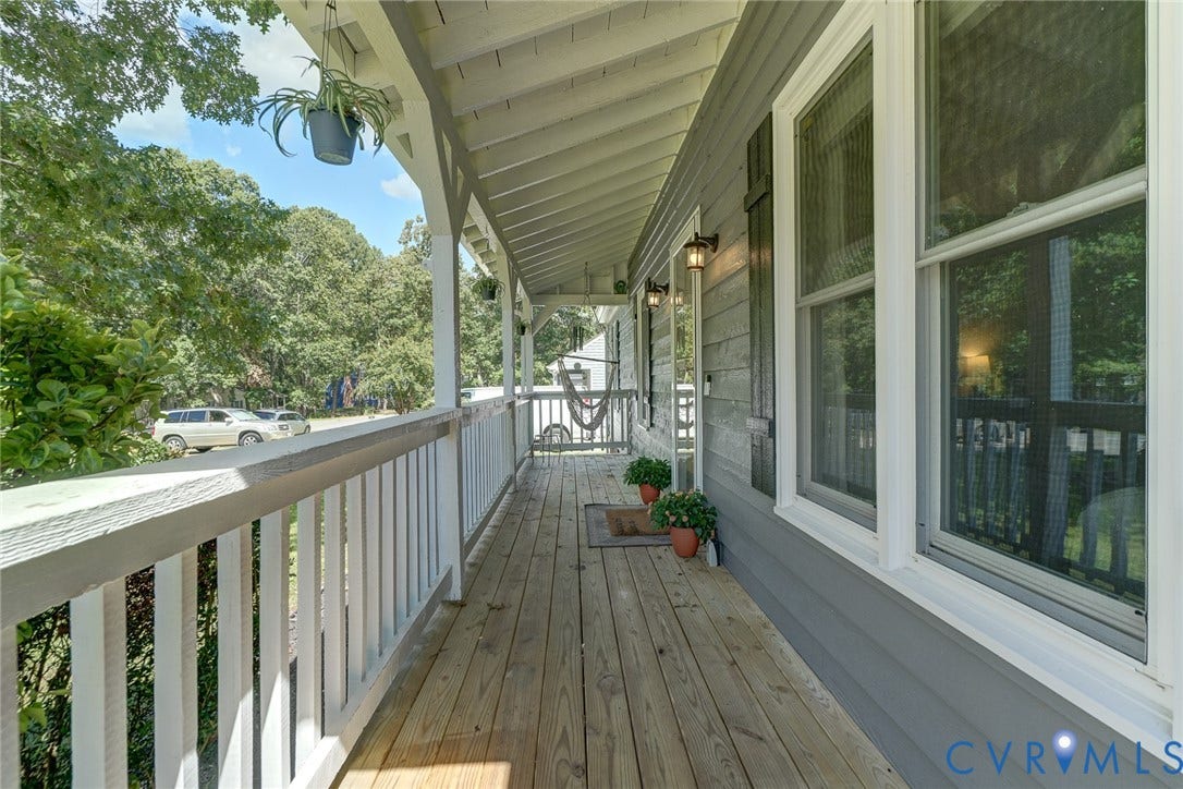 4647 Brookridge Road, Chesterfield, VA 23832 Expansive wood deck with a white railing and covered porch